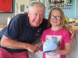 Poppy Taylor is presented with her Lifeboat painting competition prize