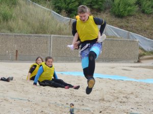 Owen helps his team mate to jump - note Annabelle on his back!!