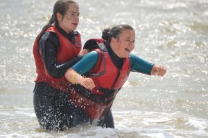 Lauren helps Jess ashore after her swim