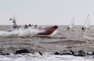 Clacton's Atlantic 85 Lifeboat "David Porter MPS" makes an impressive sight passing between the fishtail groyne and a couple of the competitors whilst out on exercise