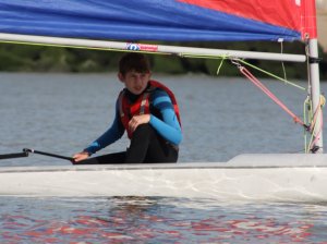  Cadet Ted Newson, in his Topper, takes on the might of the faster boats