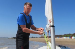 Winner of the Bill Geddes Trophy, John Tappenden, rigs his Laser prior to the start of the race