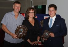 Senior Leading Helm John Tappenden, left, and Junior Leading Helm Harry Swinbourne, collect their trophies from Gunfleet's Rear Commodore Helen Swinbourne