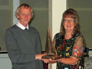 Club Treasurer Peter Downer is presented with the Gunfleet Chase Trophy - an open pursuit race that attracted visitors from other Clubs