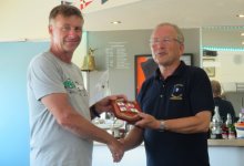 John Tappenden, left, receives his RNLI Shield for winning the Clacton Lifeboat race from Club Commodore Richard Walker