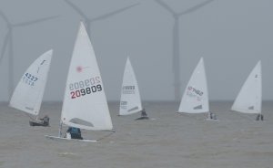 Ken Potts leads the fleet on the run from Seaward to AWS, in murky conditions