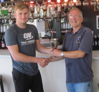 Gunfleet's Sonny Hart is presented with the 1893 Regatta cup for being first in the menagerie fleet