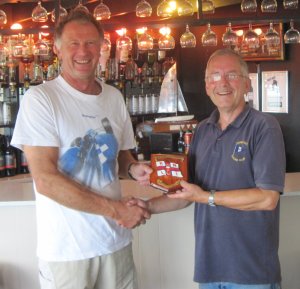 Robert Mitchell from Clacton Sailing Club receives the RNLI Shield from Gunfleet Commodore Richard Walker for winning the morning's race in his Dart 16