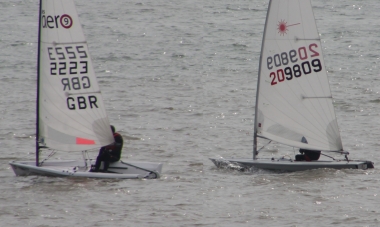 Ken Potts, in his Laser, challenges Dave Ingle in his RS Aero, early on in the race