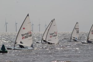 Paul Stanton, closest to shore, leads the competitors across the start line