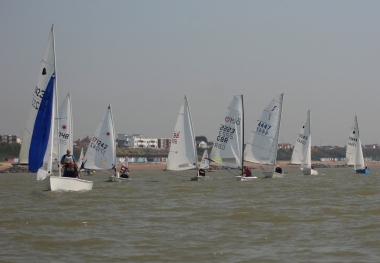 Clarke and Fowell hoist the spinnaker as they lead the fleet on the downwind leg