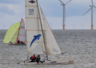 Derroll and Michael on their Hurricane, with the 29er in the background