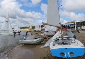A crowded beach on Monday as sailors eagerly rigged their dinghies