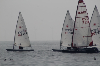 John Heath's Blaze cuts through the leeward of the fleet