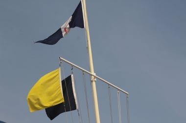 The black flag spells out the race procedure