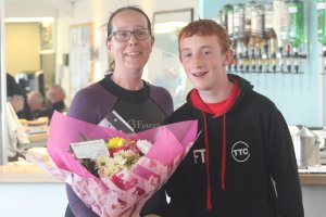 Finley presents our Cadet Officer Jo with a bouquet of flowers