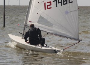 Robert Mitchell, who came third in his Laser, heads out into deceptively calm sea before the start