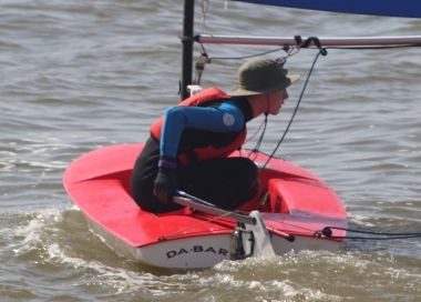  A flat sea greets Finley Taylor as he launches his Topper from the beach