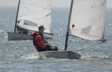 Winner of the Potts Pursuit Race - Jono Dunnett in his Laser and "trademark" sun visor