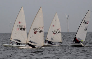 Andy Dunnett and Robert Mitchell start as they mean to go on - side by side in their Lasers.  Yvonne Gough and John Tappenden just behind