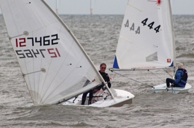 Robert Mitchell powers his Laser up, with Andy Dunnett also on the scene