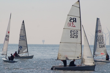  John and Sarah Heath, in their RS200, mingle with the competitors for the Coronation Trophy