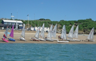 The dinghies being rigged on the beach