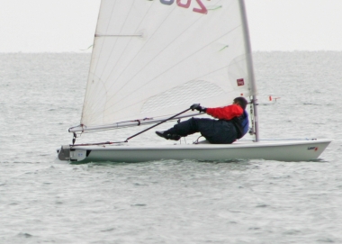Winning sailor Ken Potts takes an interesting stance as the race gets underway