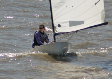 Clare Giles surfing the waves in her Europe