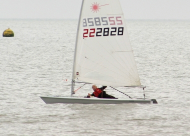 Paul Stanton cuts through the water to take the winning gun in the Laser class race