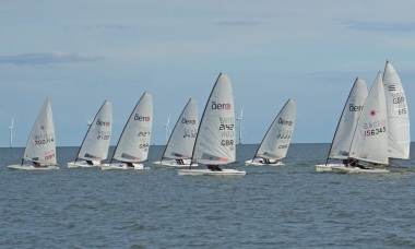 Joff Strutt leads the fleet to the start line in his Laser