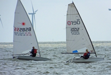 Ella Langfeldt in her RS Aero and Paul Stanton's Laser early on in the first race