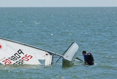 Martin Leeks rights his Laser after a sudden capsize