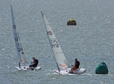 Tim Dye Hardens up and leads Brian Allen away from the AWS buoy