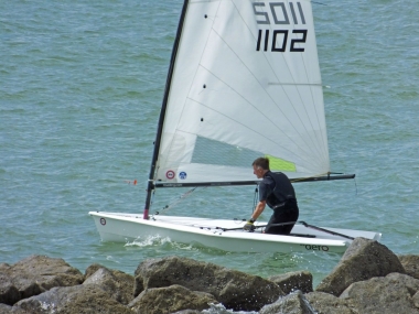 Tacking close to the groynes - John Tappenden in his RS Aero, goes on to win the Diamond Jubilee race