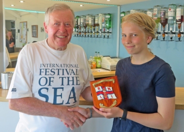 Chairman of the Gunfleet Directors Malcolm Jolly presents Ella Langfeldt with the Under 18 RNLI Charity Shield