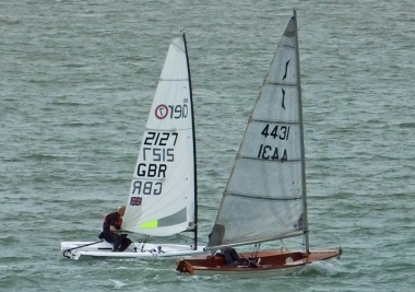 Tim Dye, in his RS Aero, overhauling Emily Cossens in her Solo