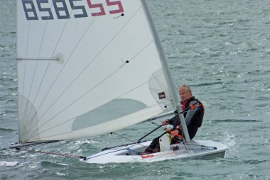Paul Stanton reaching in his Laser