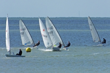 A sudden gust accelerates the boats round the Eastcliff buoy