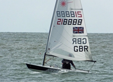 Simon Kedge catches a wave in his Laser