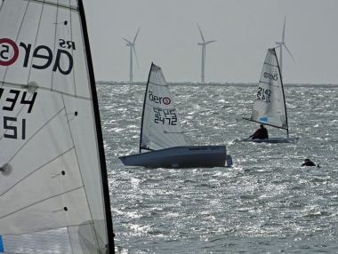 Brian Allen swims after his RS Aero after capsizing, and then righting, his boat