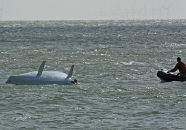 ...he ends up in the drink; the Club's Rescue Boat stands off just in case.