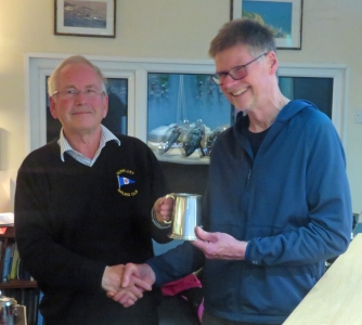 The tables are turned when Commodore Richard Walker presents Chris Maloney with the Comet Class Poits Trophy