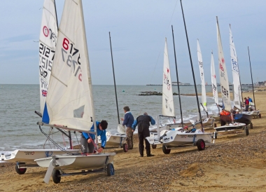 Competitors rig on the beach, ready for the March Hare race