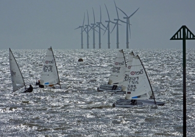 Tim Dye, Andy Cornforth and Lotte Langfeldt lead across the start line in their RS Aeros
