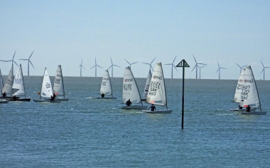 Andy Dunnett heads against the crowd as he returns to the line in his Laser
