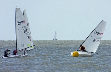 Robert Gutteridge sheets in hard as he leads the fleet around the Eastcliff buoy