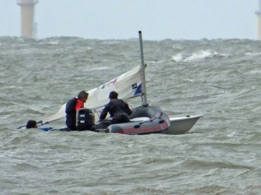 Arlo Atkins lost his mast after capsizing but is assisted by the Club Rescue Boat