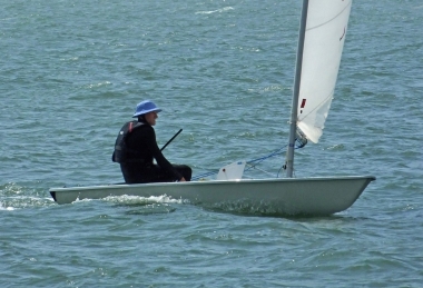 Jono Dunnett running his Laser to the finish line
