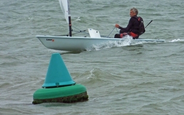 Jono Dunnett takes his Laser to victory in the Jubilee Cup race